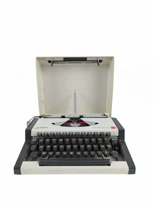 an old typewriter with a white case and black keys