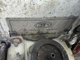 a close up view of a broken engine with a sign on it