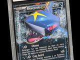 a close up of a pokemon trading card with a shark on it