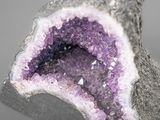 a close up picture of a purple and white piece of rock