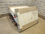a mattress that is sitting on a pallet in a room