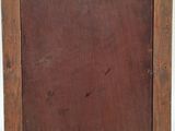 an old wooden picture frame with a piece of paper on top of it