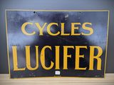 a black and yellow sign that says cycles luciferer