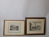 two framed pictures of a building and a vase on a table