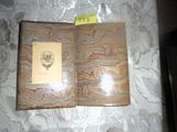 a picture of a book on a table with a yellow sticker on it