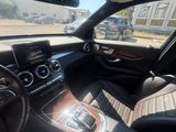 the interior of a car with a view of the road from the driver ' s seat