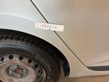 a sticker on the tire of a small car