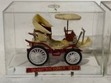 a small model of a car in a clear box