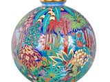 a colorful vase that is sitting on a gold stand