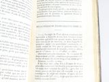 an open book on a table with a white background