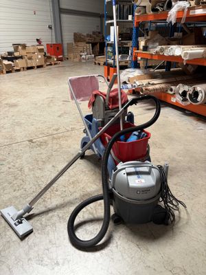 a vacuum that is sitting on the floor in a warehouse