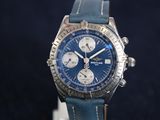 a watch with a blue dial on a blue strap