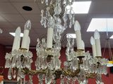 a chandelier that is hanging from the ceiling in a store