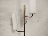 two lamps that are on the wall next to each other