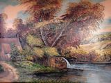 a painting on the wall of a house with a water wheel