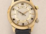 an image of a close up of a wrist watch on a white surface