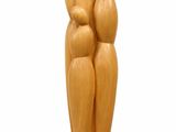 wooden sculpture of a family of three sitting on top of a wooden base