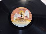 an image of a vinyl record with a picture of an angel on it