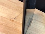 a cell phone that is sitting on a wooden table