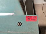 a label on the side of a machine that is sitting on a table