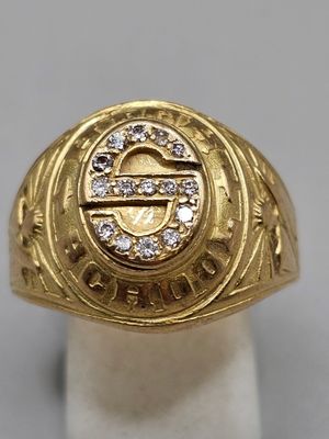 a close up of a gold ring with diamonds on it