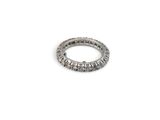 a close up of a silver ring on a white surface