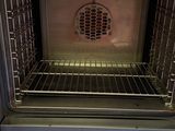 an open oven that is sitting in the kitchen