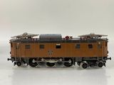 a toy train on a white surface with a white background