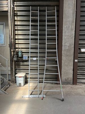 a large metal rack in front of a garage door