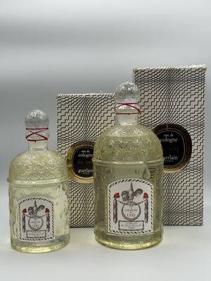 two bottles of liquor sitting next to each other on a table