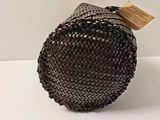 a brown woven bag with a tag on it