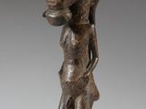 an image of a bronze statue of a woman on a pedestal