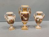 three vases that are sitting on a table
