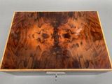 an image of a wooden box with a picture of a man on it