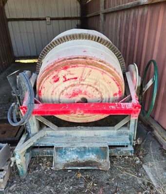 a large machine that is sitting in the dirt