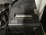 a black printer sitting on top of a black table