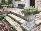 a planter that is sitting on the steps of a building