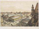 une vieille photo représentant une vue d'une ville avec des bâtiments et une tour horloge