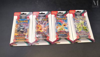 three packs of pokemon trading cards sitting on top of a table