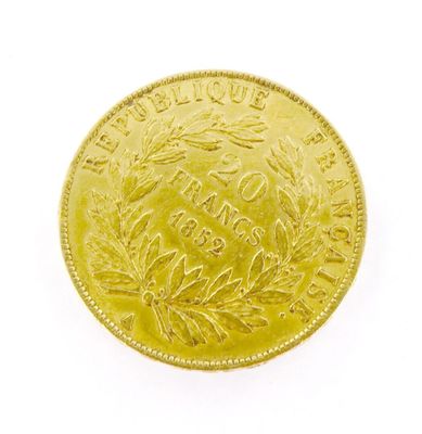 a close up of a gold coin on a white background