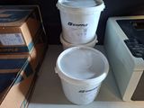 three buckets of water sitting on a shelf next to a microwave