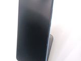 a cell phone that is sitting on top of a stand