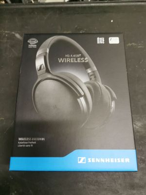 the box of a pair of headphones is sitting on a table