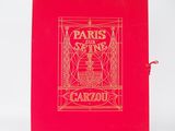 un vieux livre à la couverture rouge et aux lettres dorées