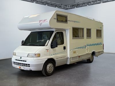 an image of a camper van parked in a garage