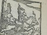 un vieux livre sur lequel figure le dessin d'un homme à cheval et d'un autre homme à cheval muni d'une lance