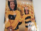 two children in bee costumes standing next to each other on a table