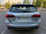 the rear end of a silver mercedes suv parked in a parking lot