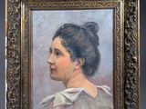 portrait of a woman in a white dress in a gold frame