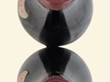 two wine bottles that are stacked on top of each other